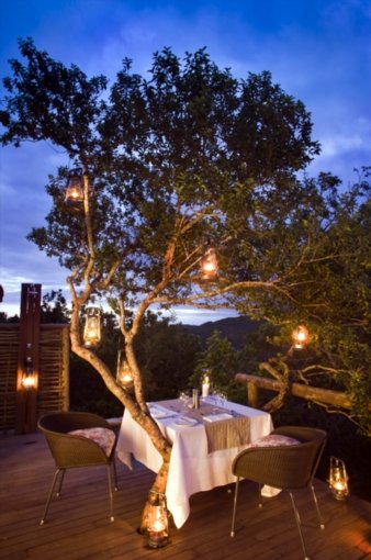 Very romantic setting on the outside deck with table laid for an intimate dinner